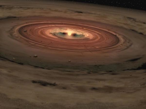Recreación artística de un sistema planetario en desarrollo